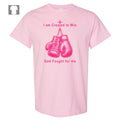 Front view of Breast Cancer Awareness t-shirt featuring pink boxing gloves artwork with "I'm created to win. God fights for me" text on cotton.