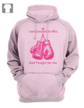 Front view of Breast Cancer Awareness hoodie featuring pink boxing gloves artwork with "I'm created to win. God fights for me" text on cotton fleece.